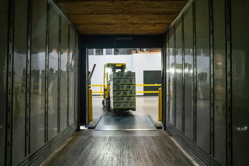 Fork lift loading food grade materials into a truck.